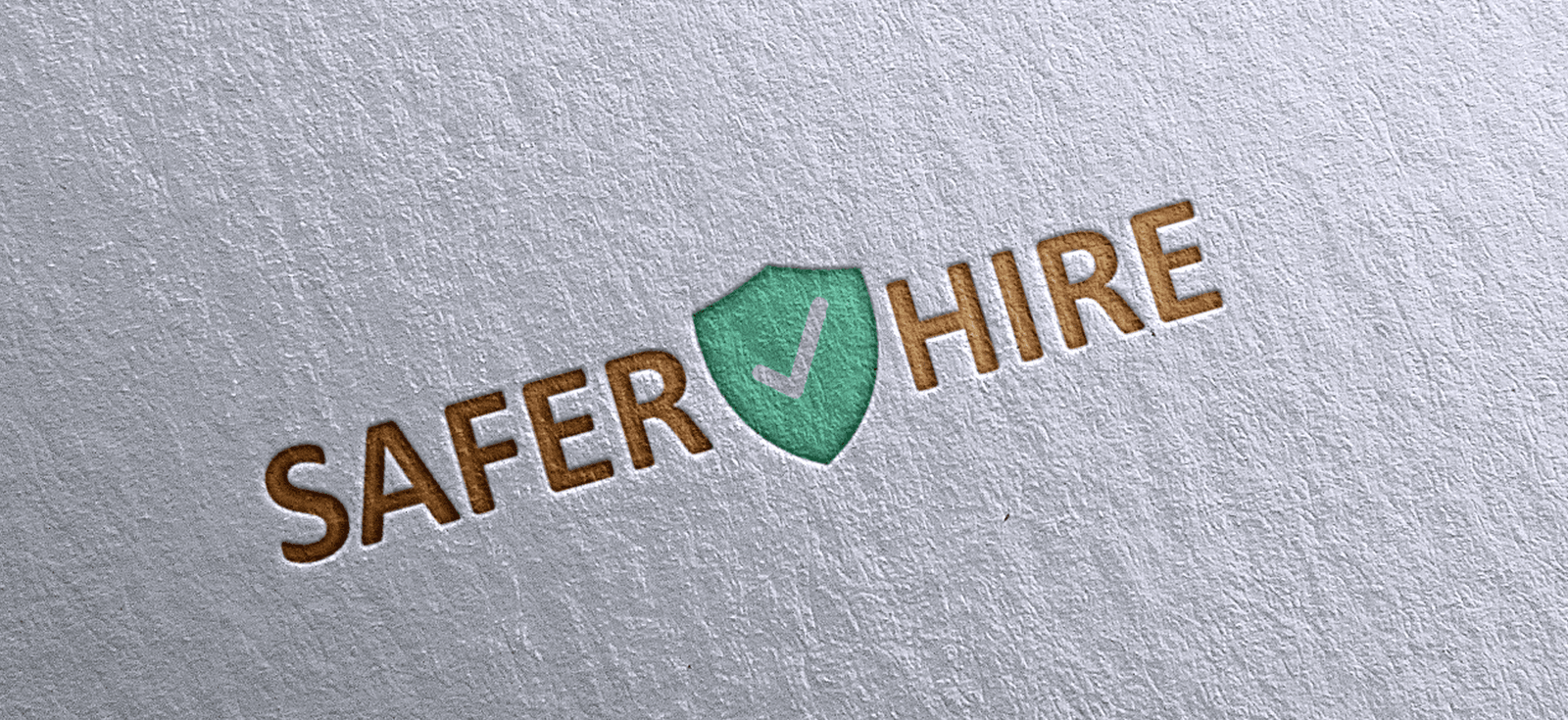 SaferHire logo engraved into paper logo mockup